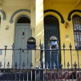 Two yellow and blue terrace houses Australia